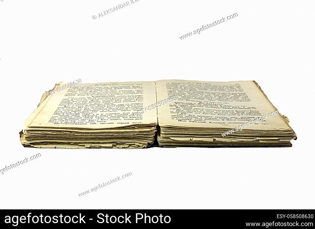 Old opened damaged book isolated on white background