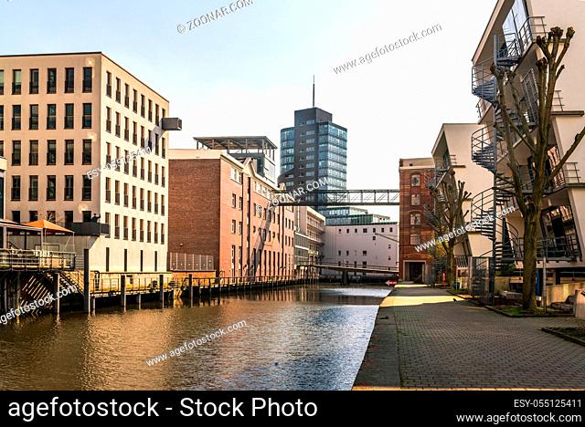 Urban development in the Harburg inland port. Old converted warehouses and new office buildings in the harbour. The city and the district are part of the...