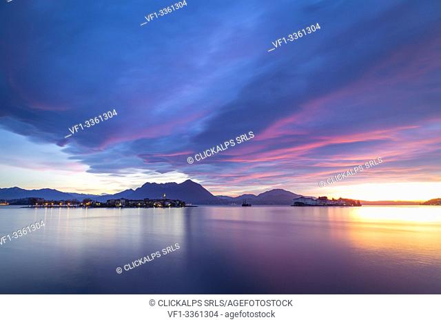 View of the Borromean Islands, Isola dei Pescatori and Isola Bella, from the shore of Baveno in a winter sunrise, Verbano Cusio Ossola, Lago Maggiore, Piedmont
