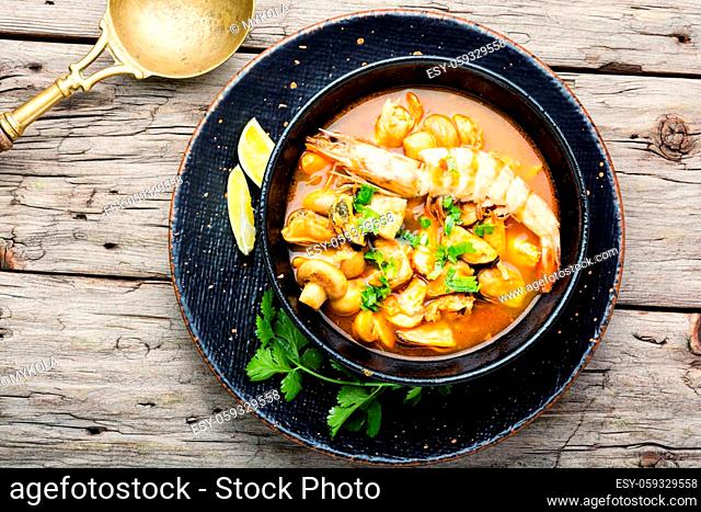 Tom yam kung spicy thai seafood soup in bowl