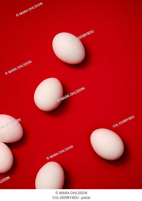 Eggs on red background