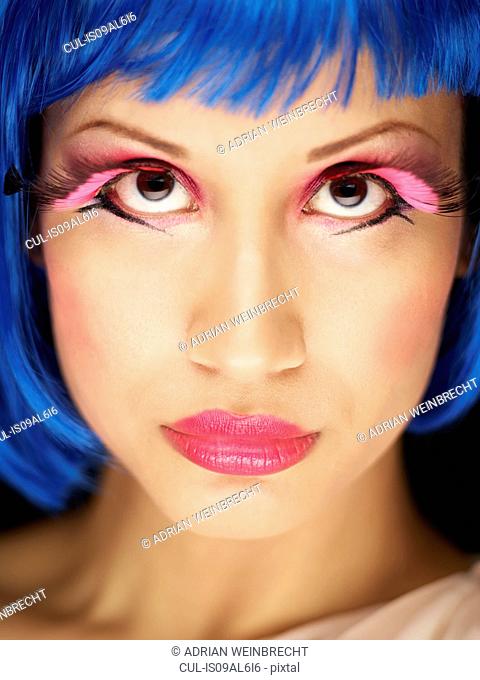 Young woman wearing fake eyelashes