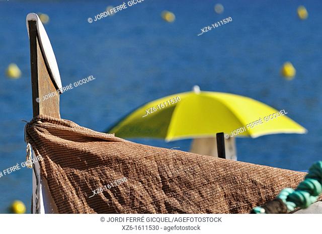 Parasol and boat, Tossa de Mar, Costa Brava, Catalonia, Spain, Europe