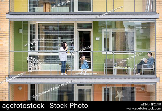 Family spending time together on balcony