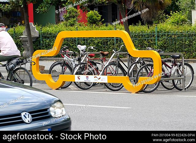 23 June 2020, Albania, Shkodra: A bicycle rack space the size of a car in Shkoder. The bicycle stand is a project of the ""Deutsche Gesellschaft für...