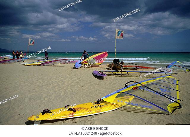 Sandy beach. Jandia. Southern peninsula. Sea. Surf. Windsurfers. Colourful sails. Flags