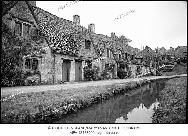 Street view of Arlington Row and the beginning of Awkward Hill, directly west, showing cottages on the left hand side and Mill Stream on the rightThe image...