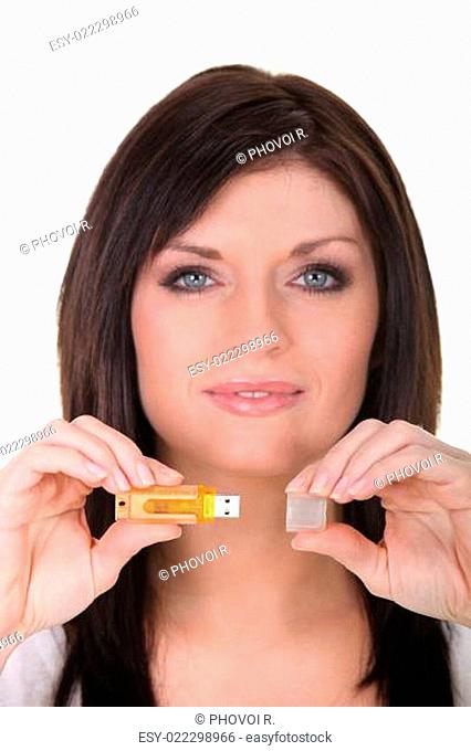 Portrait of a woman with a USB stick