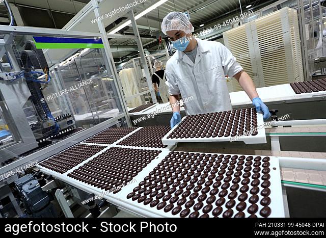10 March 2021, Saxony-Anhalt, Wernigerode: Millions of chocolate products, such as filled chocolate eggs, come off the production line at Wergona