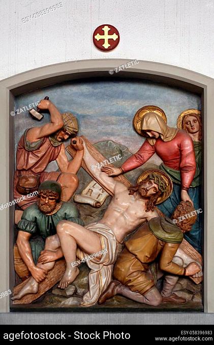 Jesus is nailed to the cross, 11th Stations of the Cross, the parish church of St. Peter and Paul in Oberstaufen, Germany