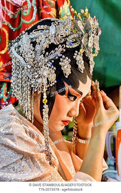 Chinese opera performer prepares for a performance at the Vegetarian Festival in Bangkok, Thailand
