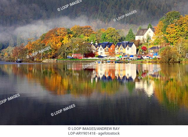 The village of Kenmore reflected in Loch Tay