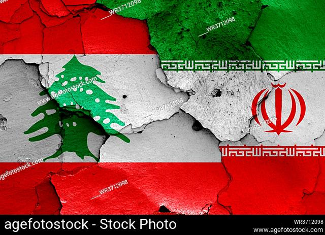 flags of Lebanon and Iran painted on cracked wall