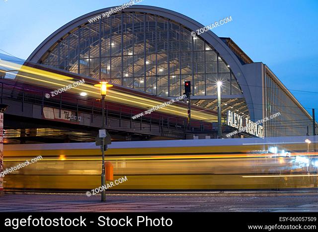 twilight scenery from famous Alexanderplatz square in Berlin with view to the railway station