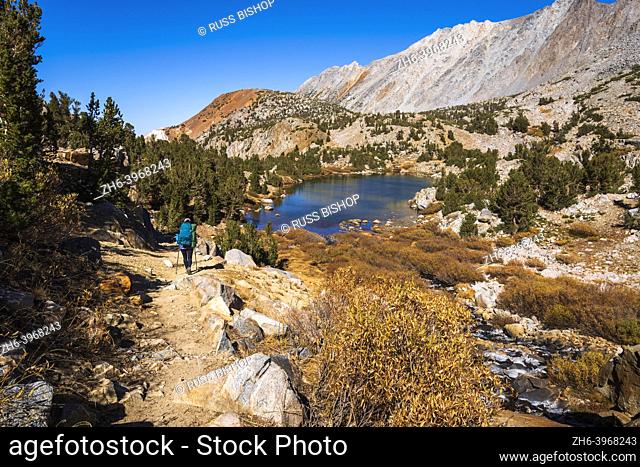 Backpacker on the Bishop Pass Trail, John Muir Wilderness, Sierra Nevada Mountains, California USA