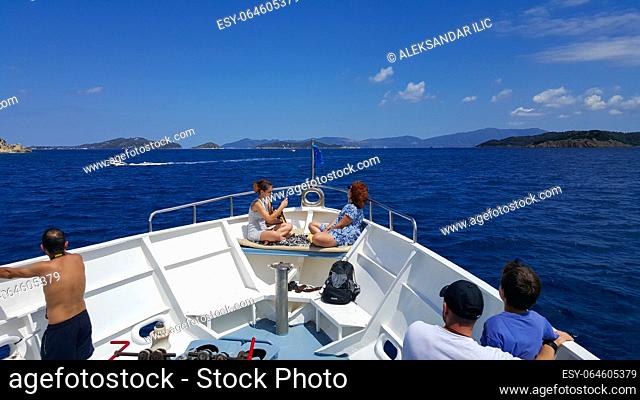 Skiathos, Greece - August 2023: Cruise ship ride at Aegean sea to Skiathos Island in Greece