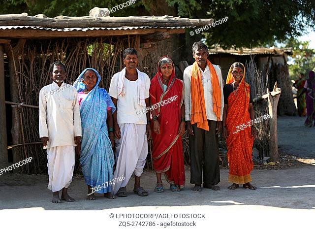 Tribal couples standing in traditional attire, ANDH TRIBE, Injegaon village, Maharashtra, India