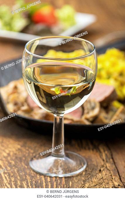white wine and swabian pork tenderloin with spaetzle on wood