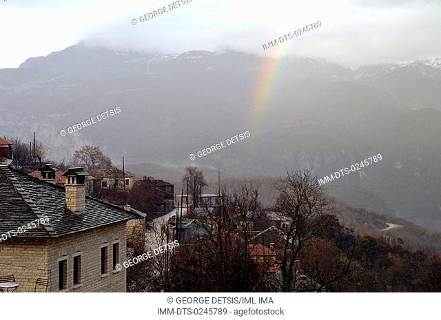 View of a rainbow over Aristi village. Ioannina, Epiros, Greece, Europe
