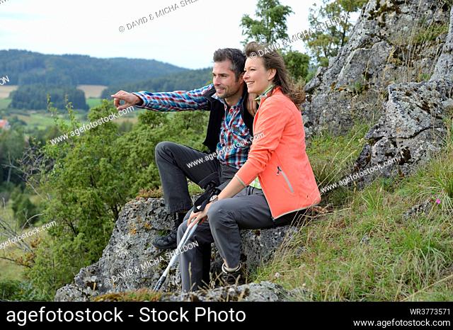 Couple taking a rest from their hiking tour