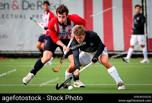 Leopold's Tom Degroote and Racing's Victor Wegnez fight for the ball during a hockey game between Royal Leopold Club and Royal Racing Club Bruxelles