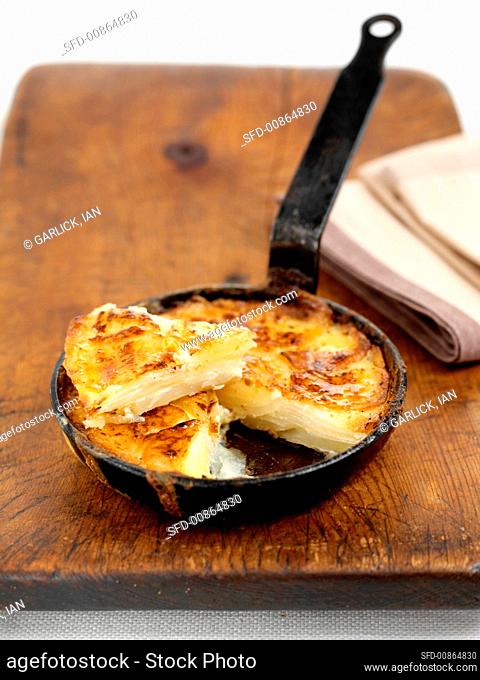 Potato gratin in a small frying pan