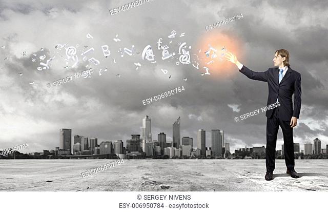 Image of a business man standing against cityscape