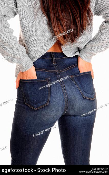 A close up image of the butt of a young woman in jeans, standing from.the back, showing her great figure, isolated for white background