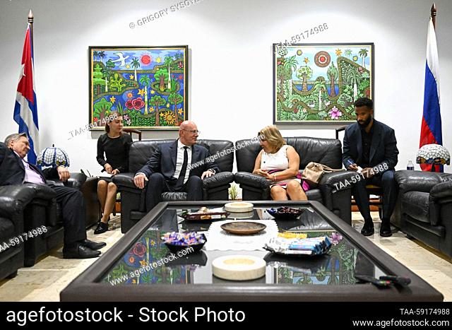 CUBA, HAVANA - MAY 17, 2023: Russia's Deputy Prime Minister Dmitry Chernyshenko and Cuba's Deputy Minister of Foreign Trade and Investment Ana Teresita Gonzalez...