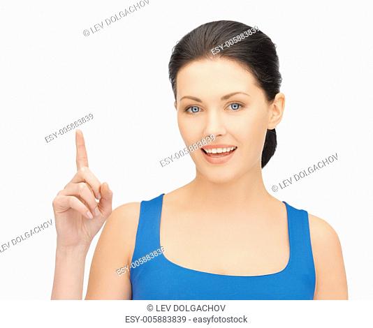 bright picture of beautiful woman pointing her finger