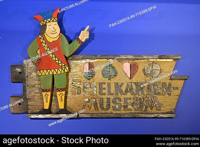16 May 2023, Thuringia, Altenburg: A weathered signpost to the Playing Card Museum is shown during the press tour of the special exhibition ""All in one hand -...