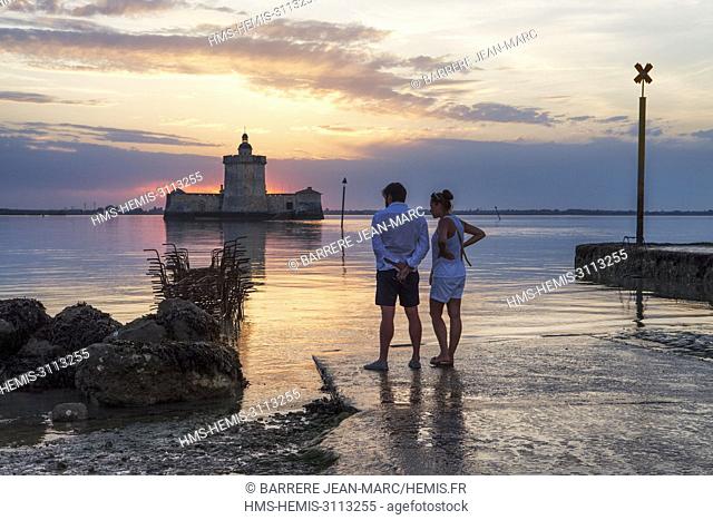 France, Charente Maritime, Bourcefranc le Chapus, Fort Louvois at sunset with the bridge of the island of Oléron in the background