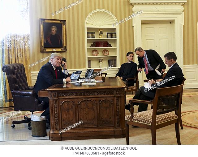 US President Donald Trump speaks with the King of Saudi Arabia, Salman bin Abd al-Aziz Al Saud in the Oval Office of the White House surrounded by Senior...