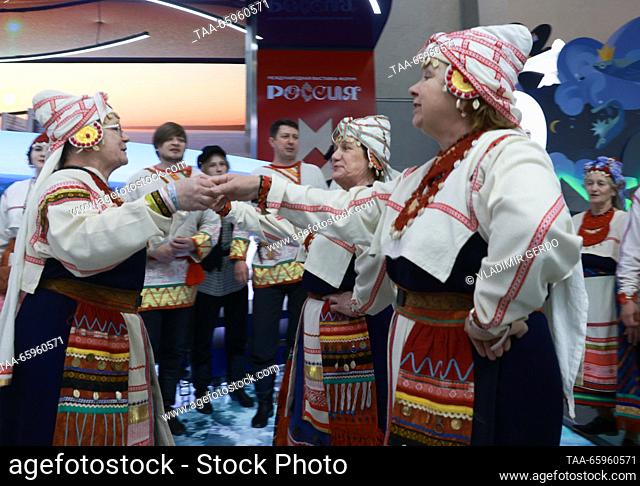RUSSIA, MOSCOW - DECEMBER 21, 2023: Members of the Kantele folk song and dance ensemble perform during the opening of Karelia Republic Day at the Russia Expo...