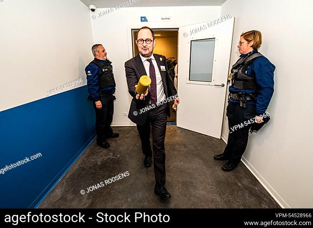 Justice Minister Vincent Van Quickenborne jokingly tosses his waterbottle at the photographer during the inauguration of the new Dendermonde Prison