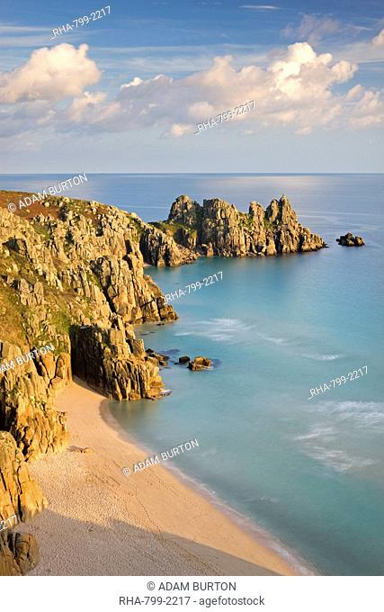 Pednvounder Beach backed by Logan Rock on Treryn Dinas headland, Porthcurno, Cornwall, England, United Kingdom, Europe