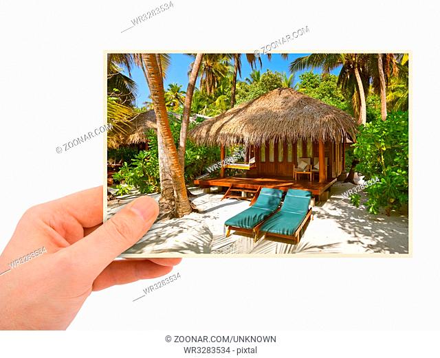 Hand and Maldives beach image (my photo) isolated on white background