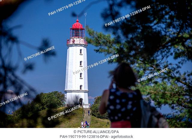 12 July 2019, Mecklenburg-Western Pomerania, Kloster: The lighthouse on the island of Hiddensee in the Baltic Sea. The lighthouse was built in 1887/1888 as a...