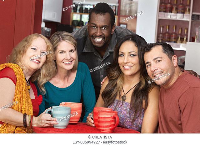 Diverse group of smiling mature adults in restaurant