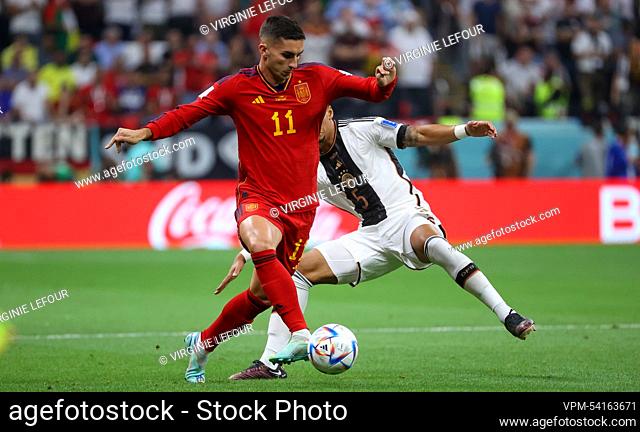 German Thilo Kehrer and Spain's Ferran Torres fight for the ball during a soccer game between Spain and Germany, in Group E of the FIFA 2022 World Cup in Al...