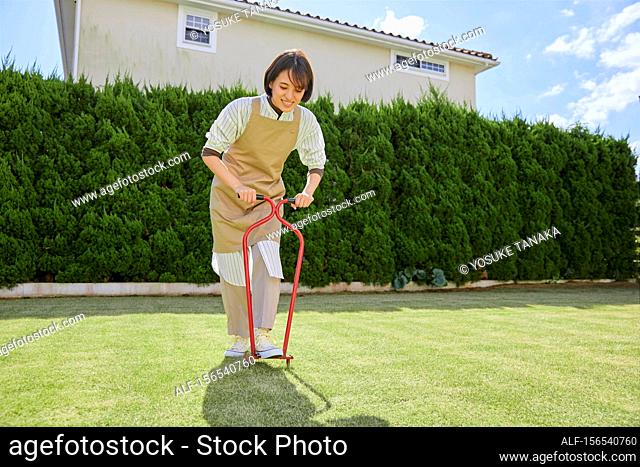 Japanese woman working in the garden