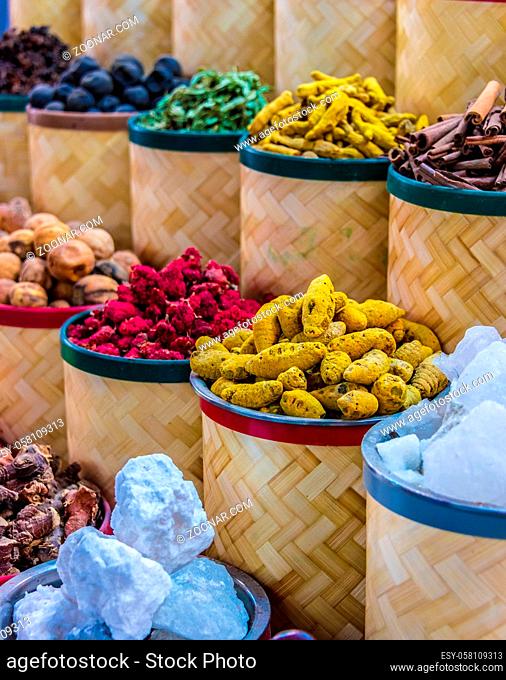 Variety of spices and herbs on the arab street market stall. Dubai Spice Souk, United Arab Emirates