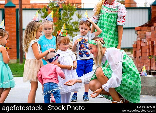 village Poltavskaja, Russia - September 8, 2017: Leisure of preschool children. Animators at a children's party. Acting and developing games for children