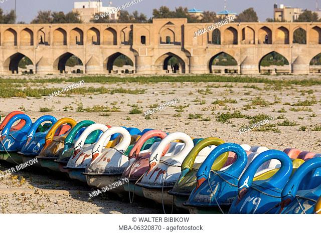 Iran, Central Iran, Esfahan, swan boats on dried out riverbed of the Zayandeh River