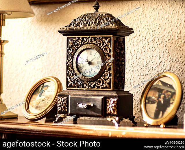 Antique clock with family photos