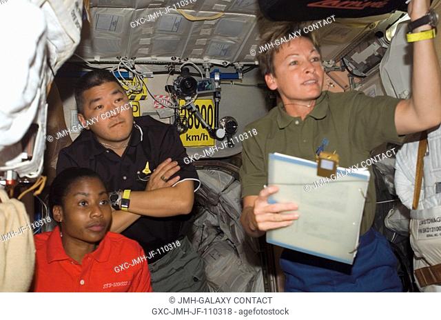 Astronauts Peggy A. Whitson (right), Expedition 16 commander; Stephanie Wilson, STS-120 mission specialist; and Daniel Tani, Expedition 16 flight engineer