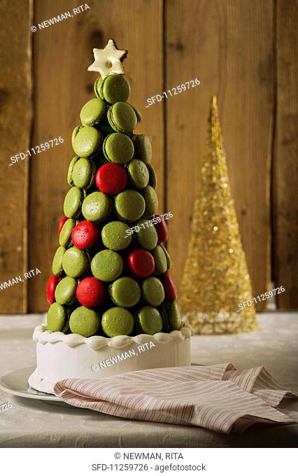 A Christmas cake decorated with redcurrant and pistachio macaroons