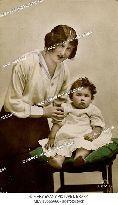 The English actress of stage and screen, Gladys Cooper (1888-1971), with one of her children (either John or Joan Buckmaster)