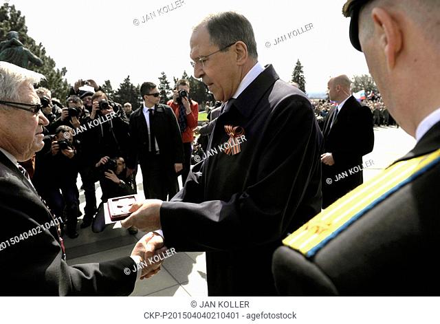 Russian Foreign Minister Sergey Lavrov (right) awards nine war veteran during a ceremony commemorating a liberation of the Slovak capital by the Red Army in...
