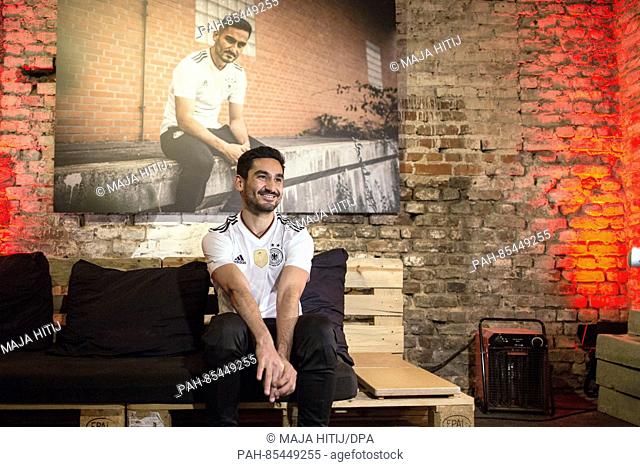 German national soccer player Ilkay Guendogan sitting on a couch during the presentation of the new home jersey of the German national soccer team by Adidas and...